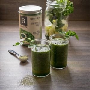 Front view Botanica health Perfect Greens unflavoured along glass of Summer refresh gluten free and vegan Maple Moringa Green Smoothie.