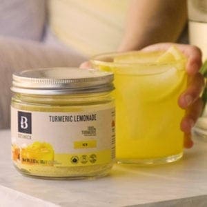 A glass of Turmeric Lemonade made with Botanica Health Turmeric Lemonade
