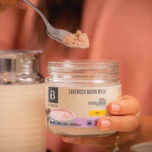 Botanica Health Lavendar Moon Mylk- Superfood Beverage open jar with spoonful of latte mix