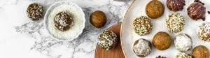 turmeric golden milk snack bites with shredded coconut, hemp hearts, coconut butter, and chocolate garnishes