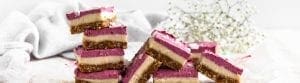 vegan raspberry cheesecake bars made using Botanica Health perfect protein vanilla. plant based protein powder. vegan, dairy free, gluten free, no bake.