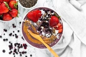 Acai Berry Smoothie Bowl made with Botanica Perfect Greens Berry and Perfect Protein Vanilla. Gluten free and vegan smoothie bowl