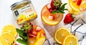 Strawberry lemonade spritz made with Botanica unsweetened turmeric lemonade.  refreshing summer drink.  vegan, gluten-free,