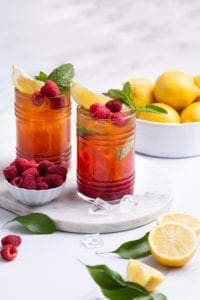 Strawberry lemonade spritz made with Botanica unsweetened turmeric lemonade. refreshing summer drink. vegan, gluten-free,