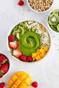 Tropical adrenal support smoothie bowl made with Botanica's Perfect Protein Elevated - Adrenal Support. Smoothie, green, spinach, mango, healthy, banana
