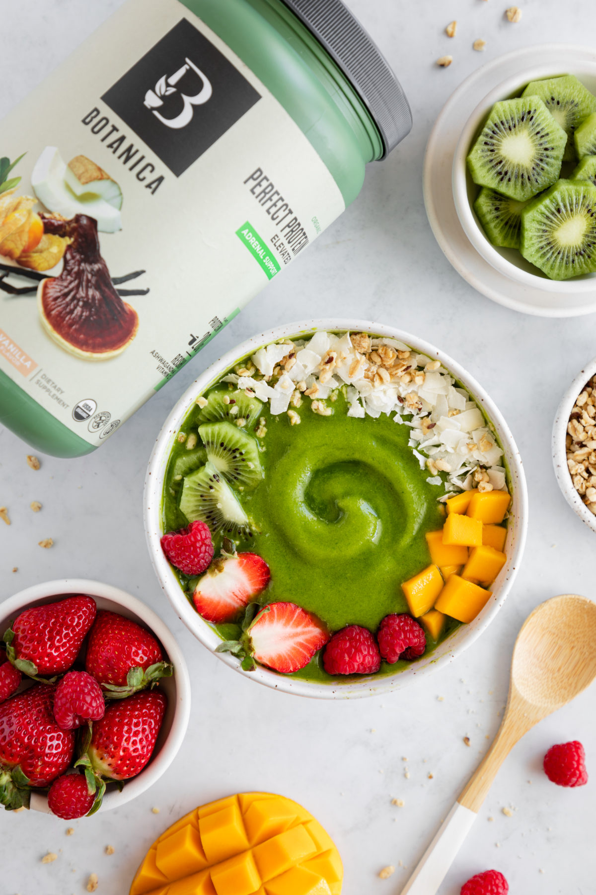 Tropical adrenal support smoothie bowl made with Botanica's Perfect Protein Elevated - Adrenal Support. Smoothie, green, spinach, mango, healthy, banana